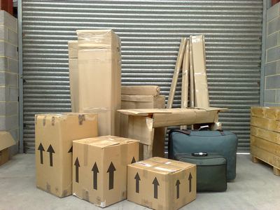 Goods and furniture securely packed in boxes and wrapped in cardboard.